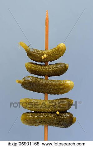 Cornichon, pickled gherkins on wooden skewer, Germany, Europe View Large Photo Image Stock Photo - Cornichon, pickled gherkins on wooden skewer, Germany, Europe. Fotosearch