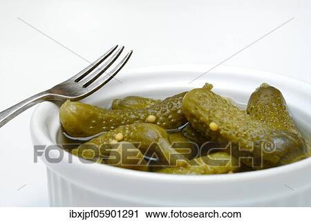 Cornichons in bowl with fork, Germany, Europe View Large Photo Image Stock Image - Cornichons in bowl with fork, Germany, Europe. Fotosearch