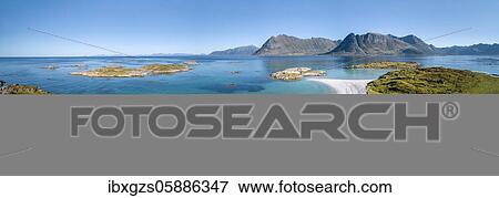 Crescent-shaped bay, white sandy beach, turquoise sea with a tiny kayak, front coast grassy, back steep mountains, Gimsøy, Lofoten, Nordland, Norway, Europe View Large Photo Image Stock Photo - Crescent-shaped bay, white sandy beach, turquoise sea with a tiny kayak, front coast grassy, back steep mountains, Gimsøy, Lofoten, Nordland, Norway, Europe. Fotosearch