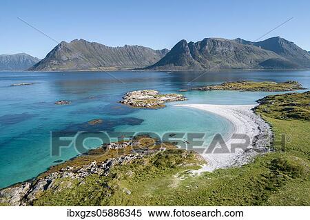 Crescent-shaped bay, white sandy beach with two kayaks, turquoise sea, front coast grassy, back steep mountains, Vågan, Lofoten, Nordland, Norway, Europe View Large Photo Image Stock Photography - Crescent-shaped bay, white sandy beach with two kayaks, turquoise sea, front coast grassy, back steep mountains, Vågan, Lofoten, Nordland, Norway, Europe. Fotosearch
