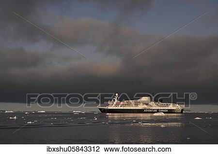 Stock Image - Cruise ship Adventure Canada in Disko Bay, Ilulissat, West Greenland, Greenland, North America. Fotosearch
