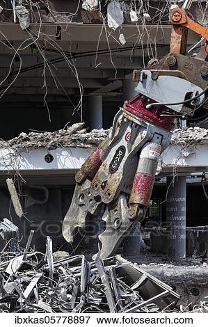 Demolition pliers, demolition shears of a hydraulic excavator, building demolition, Düsseldorf, North Rhine-Westphalia, Germany, Europe View Large Photo Image Stock Photo - Demolition pliers, demolition shears of a hydraulic excavator, building demolition, Düsseldorf, North Rhine-Westphalia, Germany, Europe. Fotosearch