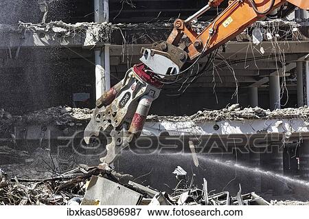 Demolition pliers, demolition shears of a hydraulic excavator, building demolition, Düsseldorf, North Rhine-Westphalia, Germany, Europe View Large Photo Image Stock Photo - Demolition pliers, demolition shears of a hydraulic excavator, building demolition, Düsseldorf, North Rhine-Westphalia, Germany, Europe. Fotosearch