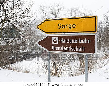 Stock Photo - Direction signs to Sorge and to the Harzquerbahn border landscape, dreary winter weather, Oberharz am Brocken, Harz district, Saxony-Anhalt, Germany, Europe. Fotosearch