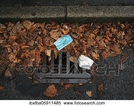Discarded respirators, street, autumn leaves, Schliersee, Bavaria, Germany, Europe View Large Photo Image Stock Photography - Discarded respirators, street, autumn leaves, Schliersee, Bavaria, Germany, Europe. Fotosearch