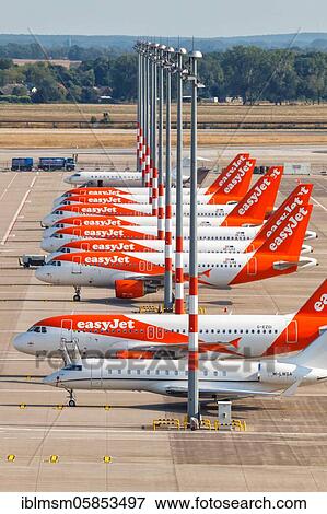 Discontinued EasyJet aircraft Coronavirus Corona Virus COVID-19 Berlin Brandenburg Airport BER Aerial photograph, Berlin, Germany, Europe View Large Photo Image Stock Photo - Discontinued EasyJet aircraft Coronavirus Corona Virus COVID-19 Berlin Brandenburg Airport BER Aerial photograph, Berlin, Germany, Europe. Fotosearch