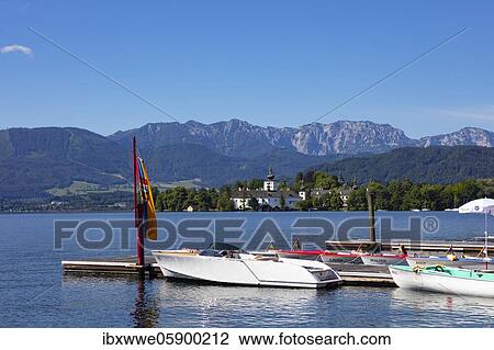 Stock Image - Electric boats with castle Ort, Gmunden, Lake Traun, Salzkammergut, Upper Austria, Austria, Europe. Fotosearch