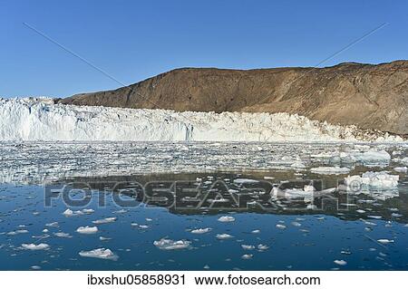 Stock Image - Eqi glacier with drift ice in the foreground, Disko Bay, West Greenland, Greenland, North America. Fotosearch