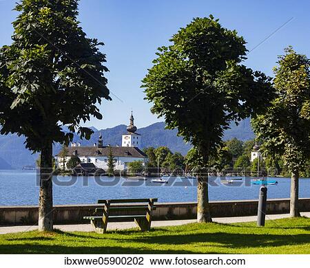 Stock Image - Esplanade with castle Ort in Gmunden, Lake Traun, Salzkammergut, Upper Austria, Austria, Europe. Fotosearch