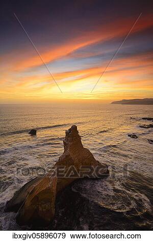 Stock Photo - Evening mood over the rock Catedral at Playa Supay, Paracas National Reserve, Paracas, Ica Region, Peru, South America. Fotosearch