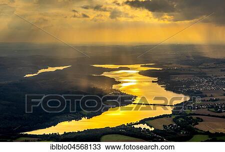 Evening sun reflected in the Möhnesee, reservoir, Sauerland, North Rhine-Westphalia, Germany, Europe View Large Photo Image Stock Image - Evening sun reflected in the Möhnesee, reservoir, Sauerland, North Rhine-Westphalia, Germany, Europe. Fotosearch
