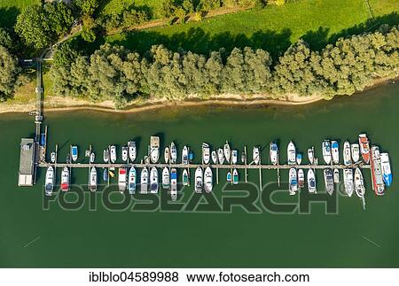 Excavation lake Niederbörmter with boat moorings, Kalkar on the Rhine, Kalkar, Niederrhein, Rhein, North Rhine-Westphalia, Germany, Europe View Large Photo Image Stock Photo - Excavation lake Niederbörmter with boat moorings, Kalkar on the Rhine, Kalkar, Niederrhein, Rhein, North Rhine-Westphalia, Germany, Europe. Fotosearch