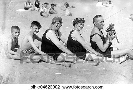 Stock Image - Family on the beach with dog ca. 1928, exact place unknown, Germany, Europe. Fotosearch