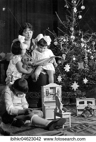 Family under the Christmas tree ca. 1930, exact place unknown, Germany, Europe View Large Photo Image Stock Image - Family under the Christmas tree ca. 1930, exact place unknown, Germany, Europe. Fotosearch