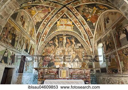 Stock Image - Famous crucifixion group by Hans Clemer, fresco in the choir, parish church of Chiesa Parocchiale, Elva, province of Cuneo, Piedmont, Italy, Europe. Fotosearch