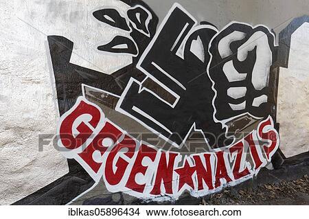 Faust smashes swastika, graffito against Nazis, Düsseldorf, North Rhine-Westphalia, Germany, Europe View Large Photo Image Picture - Faust smashes swastika, graffito against Nazis, Düsseldorf, North Rhine-Westphalia, Germany, Europe. Fotosearch