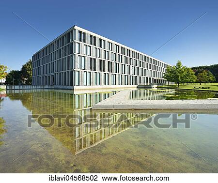 Stock Image - Federal Labour Court reflected in Wasserbassin, Erfurt, Thuringia, Germany, Europe. Fotosearch