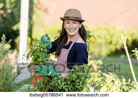 Stock Image - Female gardener. Fotosearch