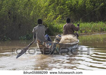 Stock Photo - Fishermen in their canoe, Niger river, Niamey, Niger, Africa. Fotosearch