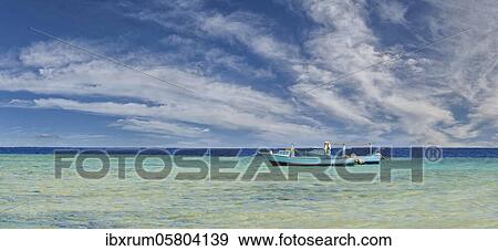 Fishing boats in the turquoise sea at the coral reef Abu-Dabbab, Hilton Nubian Resort, Al Qusair, Marsa Alam, Egypt, Africa View Large Photo Image Stock Photo - Fishing boats in the turquoise sea at the coral reef Abu-Dabbab, Hilton Nubian Resort, Al Qusair, Marsa Alam, Egypt, Africa. Fotosearch