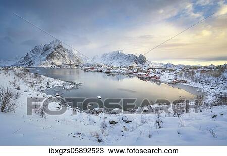 Stock Image - Fishing village Reine in winter at dawn, snowy landscape, Reinefjord, Moskenesøya, Nordland, Lofoten, Norway, Europe. Fotosearch