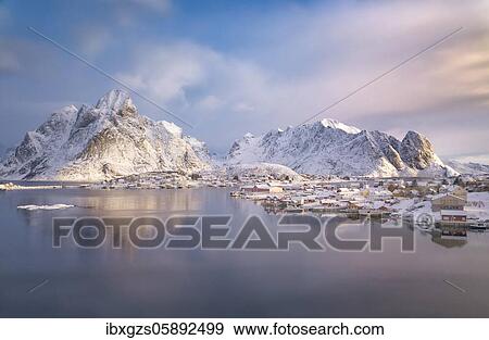 Fishing village Reine in winter at dawn, snowy landscape, Reinefjord, Moskenesøya, Nordland, Lofoten, Norway, Europe View Large Photo Image Stock Photo - Fishing village Reine in winter at dawn, snowy landscape, Reinefjord, Moskenesøya, Nordland, Lofoten, Norway, Europe. Fotosearch