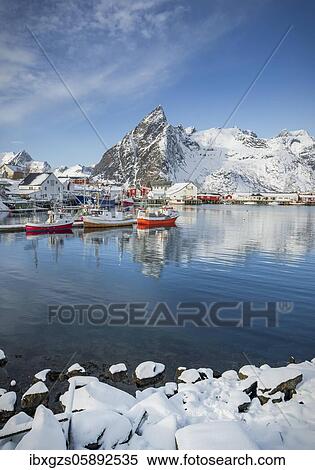 Stock Photography - Fishing village with fishermen's cabins and jetty in winter by the fjord, Hamnoy, Nordland, Lofoten, Norway, Europe. Fotosearch