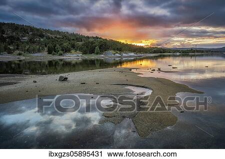 Stock Image - Fjord bay with midnight sun, Nordland, Norway, Europe. Fotosearch