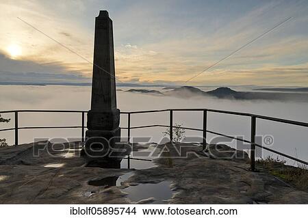 Fog in the Elbe Valley, Saxony, Germany, sunrise on Lilienstein with view into Saxon Switzerland on Papsstein and Gorisch, National Park Saxon Switzerland, Europe View Large Photo Image Picture - Fog in the Elbe Valley, Saxony, Germany, sunrise on Lilienstein with view into Saxon Switzerland on Papsstein and Gorisch, National Park Saxon Switzerland, Europe. Fotosearch