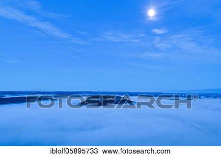 Fog in the Elbe valley, Saxony, Germany, View from Lilienstein to the fortress Königstein in the moonlight, National Park Saxon Switzerland, Europe View Large Photo Image Stock Image - Fog in the Elbe valley, Saxony, Germany, View from Lilienstein to the fortress Königstein in the moonlight, National Park Saxon Switzerland, Europe. Fotosearch