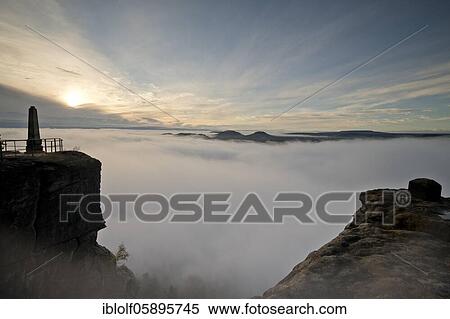 Fog in the Elbe Valley, Saxony, Germany, sunrise on Lilienstein with view into Saxon Switzerland on Papsstein and Gorisch, National Park Saxon Switzerland, Europe View Large Photo Image Stock Photography - Fog in the Elbe Valley, Saxony, Germany, sunrise on Lilienstein with view into Saxon Switzerland on Papsstein and Gorisch, National Park Saxon Switzerland, Europe. Fotosearch