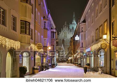Stock Photograph - Franz-Josef-Straße and parish church in winter, Schwaz, Tyrol, Austria, Europe. Fotosearch