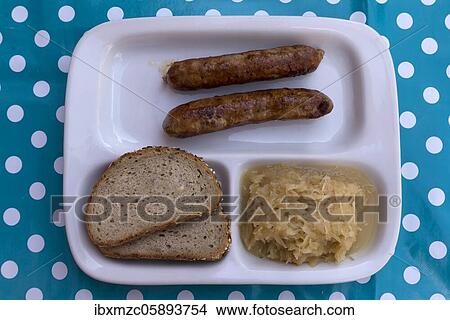 Fried sausages with sauerkraut and bread, Bavaria, Germany, Europe View Large Photo Image Picture - Fried sausages with sauerkraut and bread, Bavaria, Germany, Europe. Fotosearch