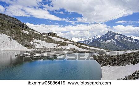 Friesenbergsee with Friesenberghaus in front of snowy mountains, Zillertal Alps, Zillertal, Tyrol, Austria, Europe View Large Photo Image Stock Photo - Friesenbergsee with Friesenberghaus in front of snowy mountains, Zillertal Alps, Zillertal, Tyrol, Austria, Europe. Fotosearch