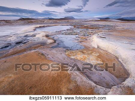 Stock Image - Fumaroles and solfatars in red plain in the high temperature area Hverir Hverarönd geothermal area in the Mývatn region, Skútustaðir, Norðurland eystra, Iceland, Europe. Fotosearch