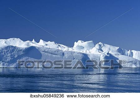 Gigantic icebergs in the ice fjord, UNESCO World Heritage Site, Ilulissat, Disko Bay, West Greenland, Greenland, North America View Large Photo Image Stock Photograph - Gigantic icebergs in the ice fjord, UNESCO World Heritage Site, Ilulissat, Disko Bay, West Greenland, Greenland, North America. Fotosearch