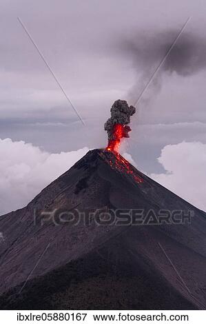 Glowing lava and smoke spitting volcano, volcanic eruption, Volcan de Fuego, Guatemala, Central America View Large Photo Image Stock Photo - Glowing lava and smoke spitting volcano, volcanic eruption, Volcan de Fuego, Guatemala, Central America. Fotosearch