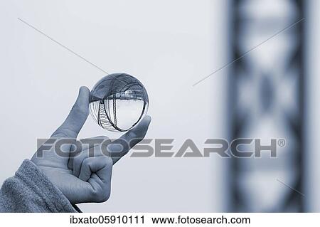 Hand holding glass ball, Old Harburg Elbe bridge is reflected in it, Harburg, Hamburg, Germany, Europe View Large Photo Image Stock Image - Hand holding glass ball, Old Harburg Elbe bridge is reflected in it, Harburg, Hamburg, Germany, Europe. Fotosearch