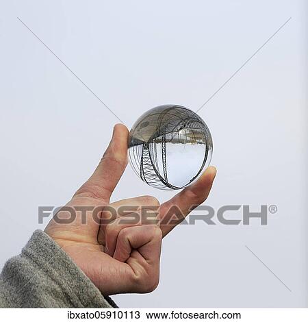 Hand holding glass ball, Old Harburg Elbe bridge is reflected in it, Harburg, Hamburg, Germany, Europe View Large Photo Image Stock Image - Hand holding glass ball, Old Harburg Elbe bridge is reflected in it, Harburg, Hamburg, Germany, Europe. Fotosearch