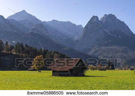Stock Photography - Hay barn, green meadow, Zugspitze in the background, mountain landscape, near Grainau, Garmisch-Partenkirchen, Upper Bavaria, Bavaria, Germany, Europe. Fotosearch