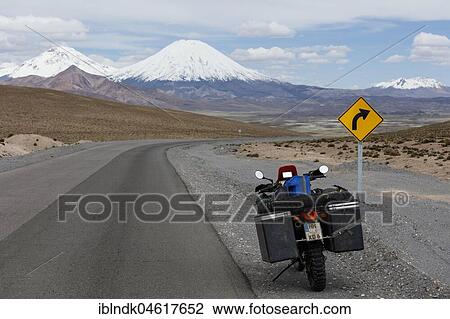 Heavily packed motorcycle at the roadside behind the volcano Pomerape, Putre, Region de Arica y Parinacota, Chile, South America View Large Photo Image Stock Image - Heavily packed motorcycle at the roadside behind the volcano Pomerape, Putre, Region de Arica y Parinacota, Chile, South America. Fotosearch