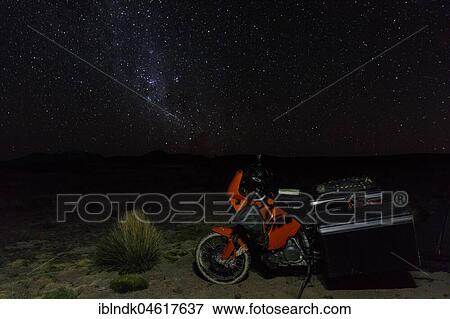 Heavily packed motorcycle on the plateau in front of the starry sky, Putre, Region de Arica y Parinacota, Chile, South America View Large Photo Image Stock Photo - Heavily packed motorcycle on the plateau in front of the starry sky, Putre, Region de Arica y Parinacota, Chile, South America. Fotosearch