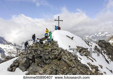 Stock Photo - Hiker at the snow-covered summit of the Schönbichlerhorn, Berlin Höhenweg, Zillertal Alps, Glacier Schlegeiskees, Zillertal, Tyrol, Austria, Europe. Fotosearch