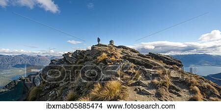 Hiker at the summit of Ben Lomond, views of Lake Wakatipu and The Remarkables mountain range, Southern Alps, Otago, South Island, New Zealand, Oceania View Large Photo Image Picture - Hiker at the summit of Ben Lomond, views of Lake Wakatipu and The Remarkables mountain range, Southern Alps, Otago, South Island, New Zealand, Oceania. Fotosearch