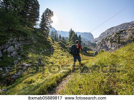 Hiker, mountain landscape, Stuhlgraben, Grießkogel in the back, Funtenseetauern, Berchtesgaden National Park, Berchtesgadener Land, Upper Bavaria, Bavaria, Germany, Europe View Large Photo Image Stock Photo - Hiker, mountain landscape, Stuhlgraben, Grießkogel in the back, Funtenseetauern, Berchtesgaden National Park, Berchtesgadener Land, Upper Bavaria, Bavaria, Germany, Europe. Fotosearch