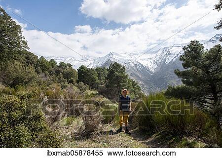 Hiker on a hiking trail, hiking trail Vereda de la Estrella, behind Sierra Nevada with summits Mulhacén and Pico Alcazaba, snow-covered mountains near Granada, Andalusia, Spain, Europe View Large Photo Image Stock Photography - Hiker on a hiking trail, hiking trail Vereda de la Estrella, behind Sierra Nevada with summits Mulhacén and Pico Alcazaba, snow-covered mountains near Granada, Andalusia, Spain, Europe. Fotosearch