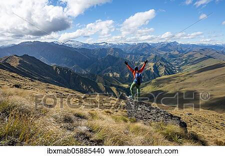Hiker stretches out his arms in the air, hiking trail to Ben Lomond, views of mountains, Southern Alps, Otago, South Island, New Zealand, Oceania View Large Photo Image Stock Image - Hiker stretches out his arms in the air, hiking trail to Ben Lomond, views of mountains, Southern Alps, Otago, South Island, New Zealand, Oceania. Fotosearch