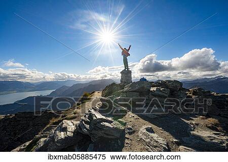 Hiker stretches out his arms in the air, summit of Ben Lomond, view of Lake Wakatipu, Southern Alps, Otago, South Island, New Zealand, Oceania View Large Photo Image Stock Photography - Hiker stretches out his arms in the air, summit of Ben Lomond, view of Lake Wakatipu, Southern Alps, Otago, South Island, New Zealand, Oceania. Fotosearch
