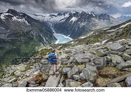 Hiking on the Berlin High Altitude Trail, Schlegeis Reservoir, Schlegeis reservoir, Zillertal Alps, Schlegeiskees Glacier, Zillertal, Tyrol, Austria, Europe View Large Photo Image Picture - Hiking on the Berlin High Altitude Trail, Schlegeis Reservoir, Schlegeis reservoir, Zillertal Alps, Schlegeiskees Glacier, Zillertal, Tyrol, Austria, Europe. Fotosearch