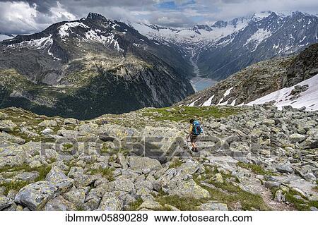 Hiking on the Berlin High Altitude Trail, Schlegeis Reservoir, Schlegeis reservoir, Zillertal Alps, Schlegeiskees Glacier, Zillertal, Tyrol, Austria, Europe View Large Photo Image Stock Photo - Hiking on the Berlin High Altitude Trail, Schlegeis Reservoir, Schlegeis reservoir, Zillertal Alps, Schlegeiskees Glacier, Zillertal, Tyrol, Austria, Europe. Fotosearch
